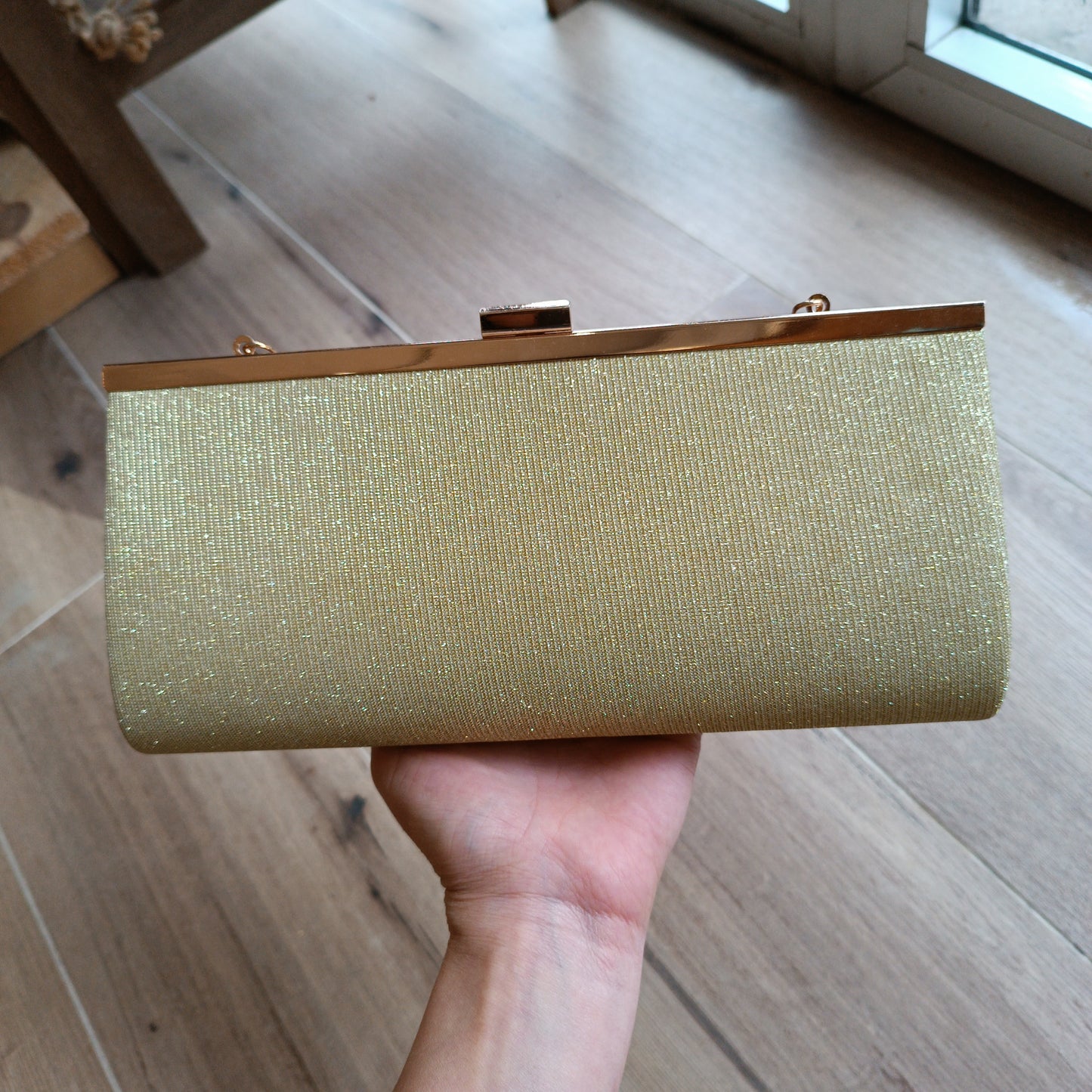 Cartera brillo dorado