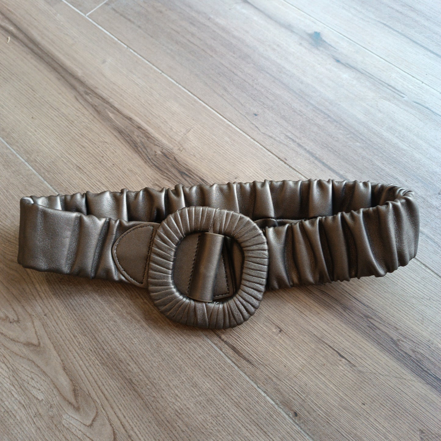 Cinturón elástico bronce